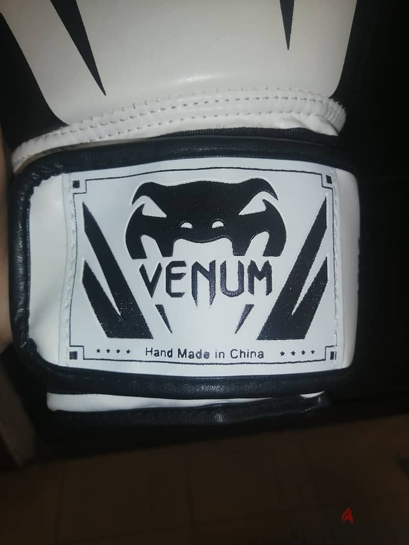Venum boxing gloves with hand wraps 3