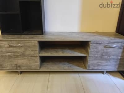Tv screen table with small library