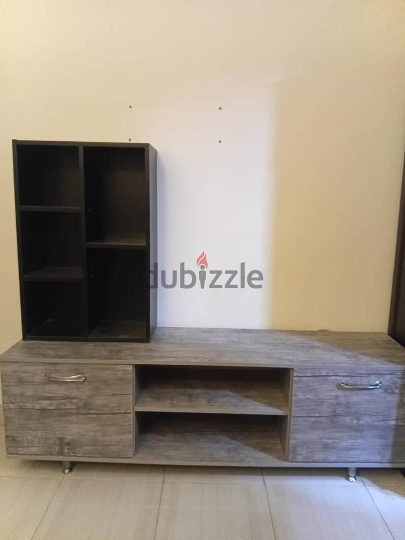 Tv screen table with small library 2