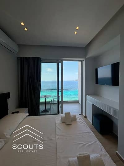 A fully furnished hotel apartment with air conditioning, ready for immediate handover in Alamein Towers, with amazing views and right on the sea,
