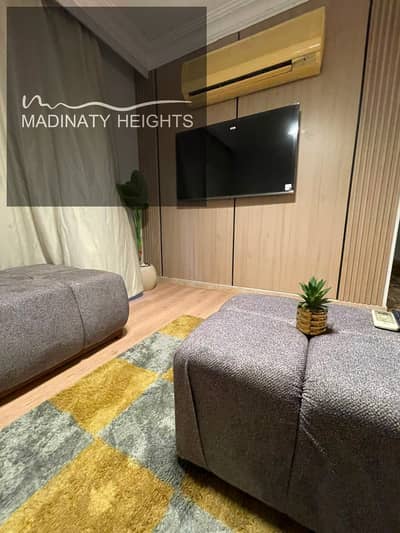 Furnished apartment for rent in area B7, area: 96 meters, floor: third, 2 bedrooms, 2 bathrooms, wide garden view, required: 35,000 EGP per month for short periods, 30,000 EGP per month for contracts from 6 months to a year