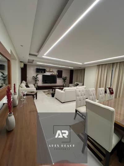 A ground floor hotel apartment with a private garden for sale, furnished and equipped, next to Avenue Mall in Al-Rehab City - First Settlement - New Cairo