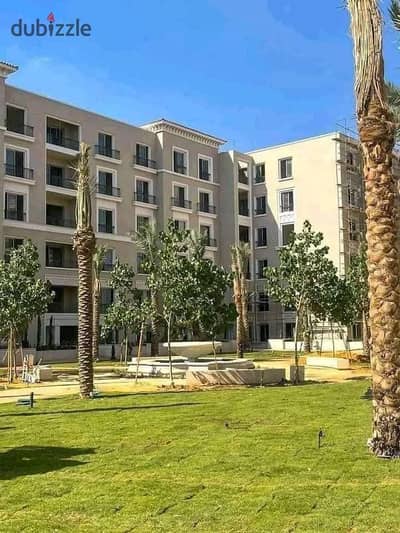 Ground-floor apartment with a garden for sale in the Village West compound, Sheikh Zayed; available for immediate handover at a very attractive price