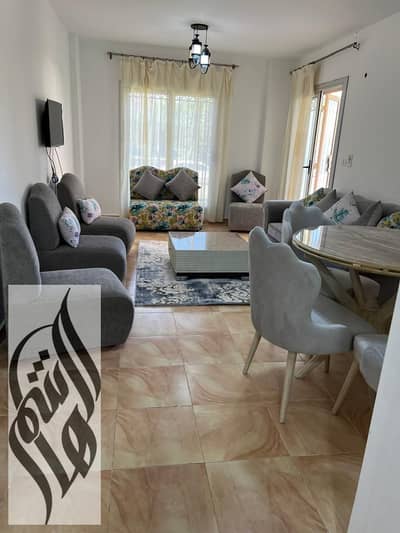 Furnished 100 sqm apartment in Madinaty B2, ground floor with garden, 2 bedrooms, 1 bathroom, close to mosque and services, EGP 30K/month.