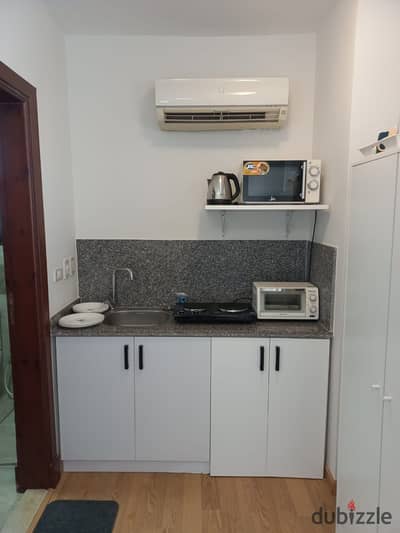 Furnished studio for rent in Westown SODIC below market price. Hotel finishing, room, bath, roof, ACs & elevator to door.