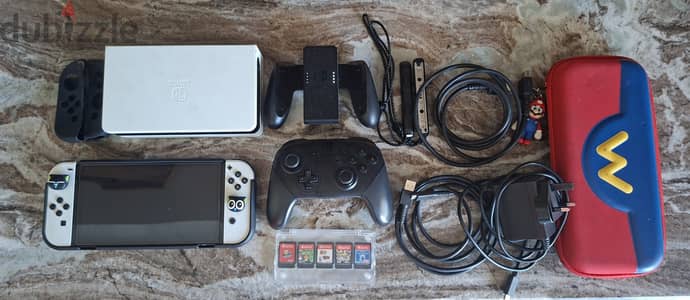 Nintendo Switch OLED + Extra Pro controller + 5 Games + AllAccessories
