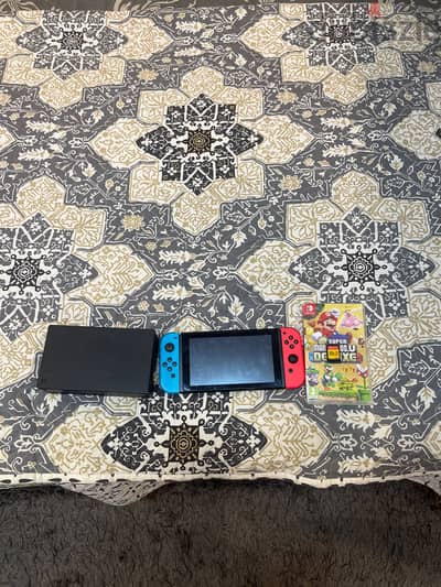 Nintendo Switch 1 + New Super Mario Bros Deluxe + Super Mario Maker 2