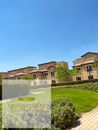 Ready-to-move-in villa for sale in a prime location within a compound overlooking a large landscaped garden.