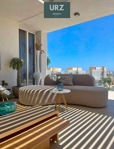 في شالية صف اول lagoon & seaview بموقع بانورامي fully finished + ACs مميز وبخصم 35 % من سعر للبيع في الساحل الشمالي بالقرب مراسي و مدن و ذا مد و سيزن