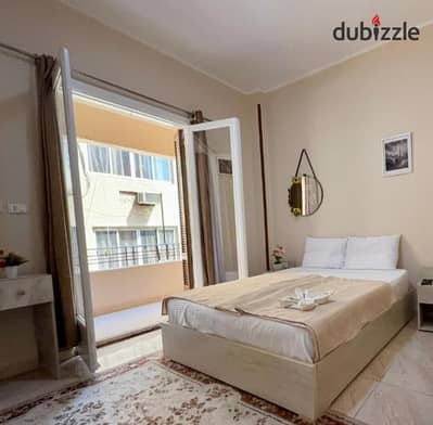 Furnished apartment with air conditioning between Mustafa El-Nahas and Al-Ahly Club, next to Farhat Restaurant, fully equipped, super lux