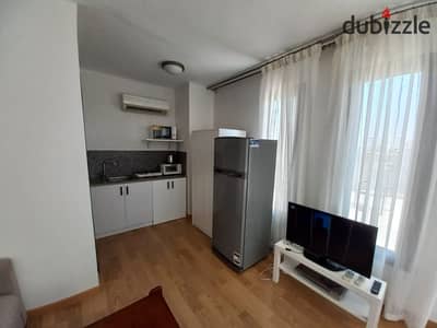 Furnished studio for rent in Westown SODIC. Hotel-style finishing, 1BR, bathroom, private roof, AC & direct elevator access. Great rate!