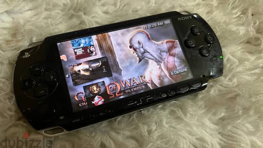 psp 1000 +شاحن + الكرت8جيجا +بطارية