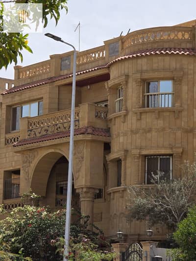 Full floor apartment for sale in Al-Narges, garden view and two garage units. Second line from Al-Teseen Street and near Gamal Abdel Nasser Axis.