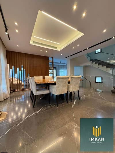 260m² duplex with a 110m² garden for sale—with an 8-year installment plan—located next to the American University in the 90 Avenue compound, Fifth Set