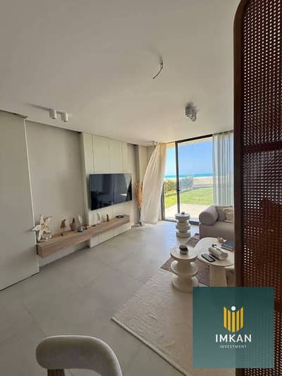 Fully finished chalet for sale in the Bungalows North Coast resort, directly facing the sea, with a down payment of only 400,000 and a 9-year installm