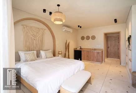 Chalet for sale with sea view, super deluxe finishing, in the North Coast, Ras El Hekma area, in Seashore Village, next to Hacienda West.