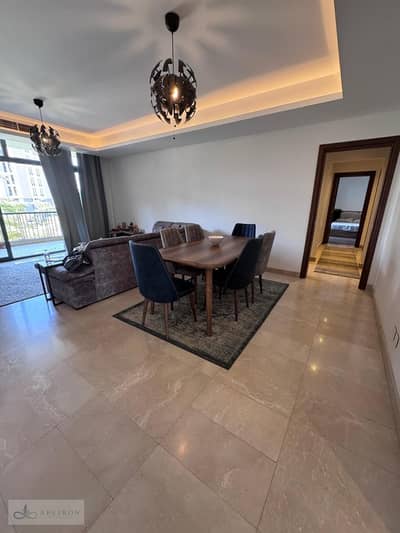 Luxury 156 sqm first-floor apartment in Ora Cairo Festival, overlooking landscaped gardens. Features 2 master bedrooms with en-suite bathrooms (one wi