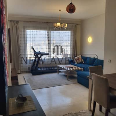 Under market price Studio in village gate palm hills in the golden square around AUC Prime location fully furnished with Ac's Ready to move