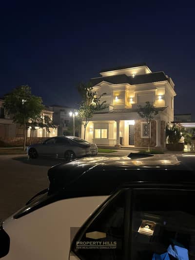 Ali received the key for a finished villa for sale in Mountain View 1 next to the American University and Mivida