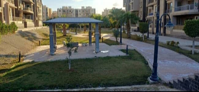 Furnished apartment for rent in Dar Misr, District 12, Sheikh Zayed. Features modern finishing and furnishings, landscaping, a wonderful view