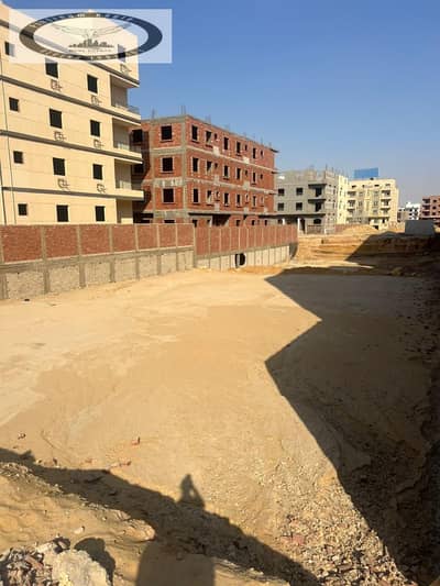 Plot of land for sale in Fifth Settlement – ​​Beit Al-Watan (District 1), situated on a main road near Al-Teseen Street and Suez Road.