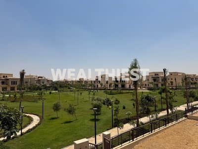 A distinctive standalone villa for sale in Four Seasons – VG3, Madinaty, featuring a large land area, a wide garden view, and a convenient payment pla