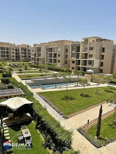 Ground floor apartment with private garden, ready for immediate occupancy, fully finished with air conditioning, in a prestigious compound in Fifth Se