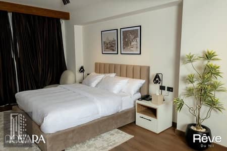 With rental income in dollars, receive a 32 sq m fully finished, air-conditioned hotel apartment with a Nile view, next to the Hilton Hotel in Reve du