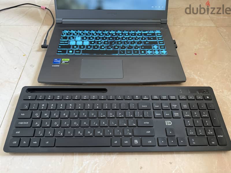 Wireless Bluetooth Keyboard with Phone Holder - (ENG/AR) 3