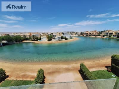 own your corner town house villa direct view on lagoon ,ready to move
