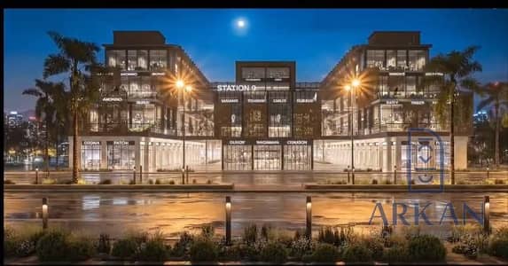 The 51-meter front on the main road next to the Ajala and the park in October Gardens, second floor, delivery in a year and a half