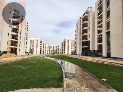 Fully finished apartment for sale in Bliss Gate Compound, Sheikh Zayed; immediate delivery, situated in the compound's prime location.