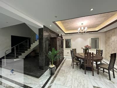 Furnished villa for rent in Madinaty Model E  500m and 3 floors with a garden of 880m direct view of the golf course deluxe finishing with Spanish marble and fully furnished with central air conditioning