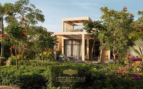 A villa for sale by Orascom, 3 floors, panoramic view overlooking the landscape in O West, next to Gardenia Park 1, West Somed, and Upville.