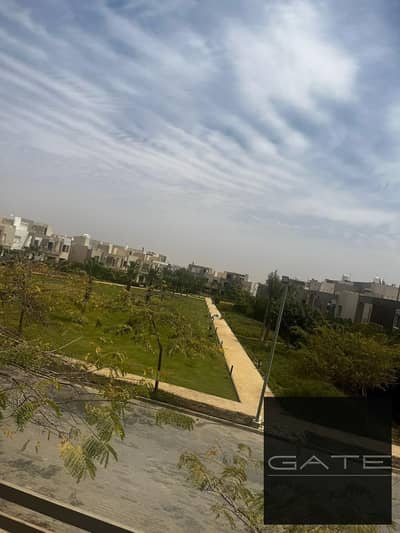 Corner townhouse for sale in Woodville Palm Hills compound, prime location within the compound with a view of the landscape.