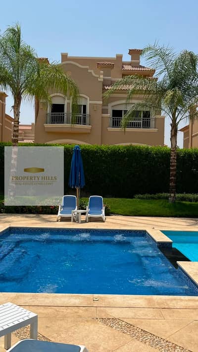 Villa for sale in Al Shorouk near Gate 2, Al Shorouk, ready for delivery in Patio 5 East with a view of green areas