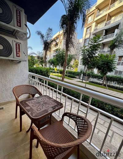 Modern 2BR AC ground-floor apartment, garden view, WiFi, full amenities. Near market & mosque. Families only (Marriage contract required).