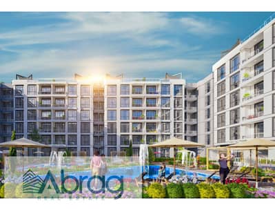 169m² apartment for sale via installment plan, including a free Al Ahly Club membership, in Rovan City Compound, Sheikh Zayed.