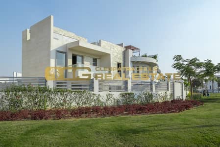 Twin House for Sale with Immediate Delivery in Cleopatra Square Compound 6 October Directly on July 26 Axis in Front of Arkan Plaza
