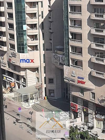 Furnished apartment available for daily rent (1,000 EGP) or monthly rent (20,000 EGP) on Makram Ebeid Main Street, Nasr City. Offered directly