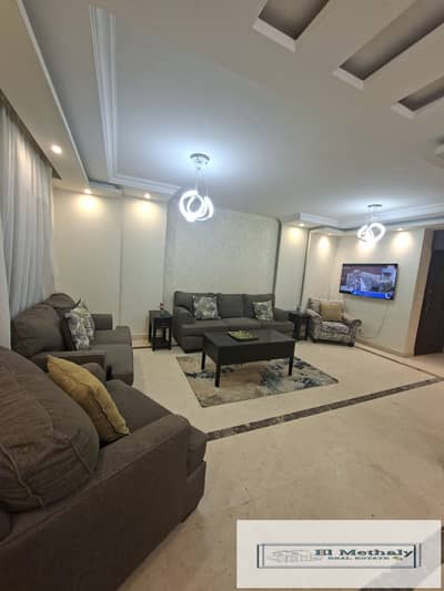 Furnished apartment for rent in Al Rehab City, New Cairo; features a wide garden view and is located next to the Old Market and amenities.