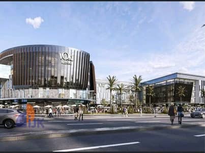 Prime clinic for sale, 21 square meters, directly on Sadat Axis, with a Plaza view, in the heart of Fifth Settlement, New Cairo