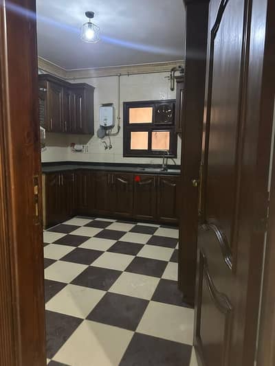 Apartment for rent with air conditioning and a wooden kitchen next to Genie Mall