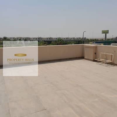 Last duplex for sale with a large roof area in Al Burouj Compound in Al Shorouk with a view of green spaces