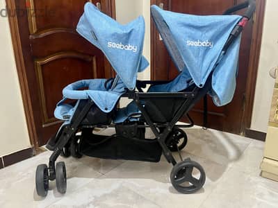 عربة أطفال مزدوجة (توأم) Seebaby - استعمال خفيف جديده إقراء التفاصيل .