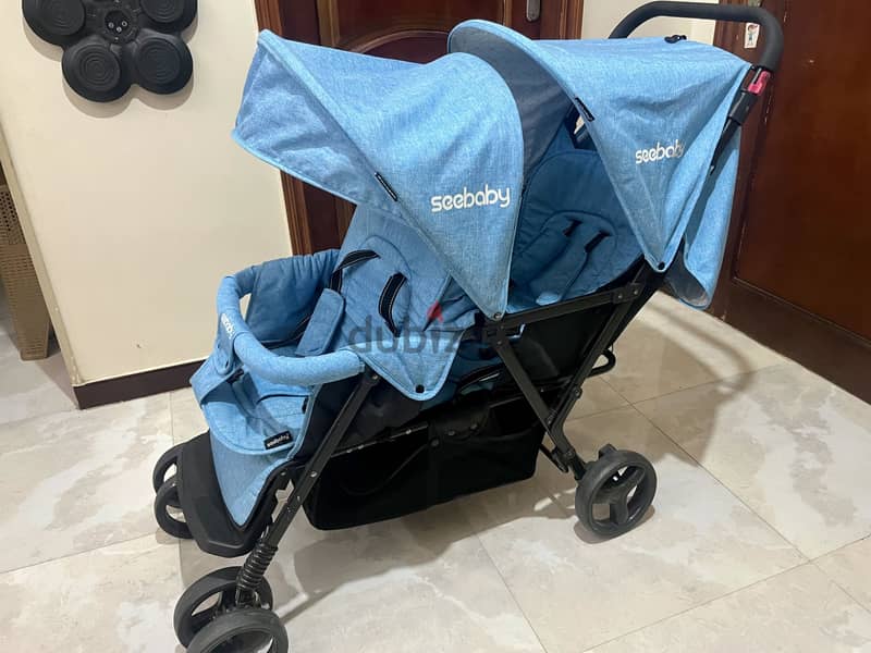 عربة أطفال مزدوجة (توأم) Seebaby - استعمال خفيف جديده إقراء التفاصيل .