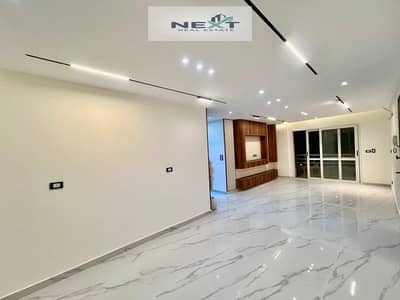 An excellent opportunity in Madinaty: a 143m² apartment with custom finishes and an open garden view. It is a first-time occupancy unit, ready for imm
