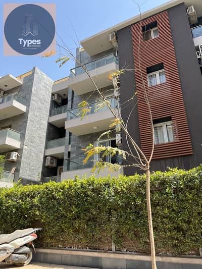 Ground floor apartment with garden for sale in Dunes Compound, Sheikh Zayed. 100 square meters, 40 square meter garden, two bedrooms, two bathrooms. S