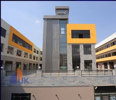 Commercial shop for sale, ready for immediate occupancy, currently rented for 34,200 EGP per month, in the heart of Al Shorouk City, walled compound w