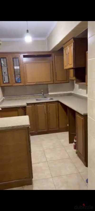 Apartment for rent in Nasr City, Embassy District, Super Lux with a new kitchen, new paint, two rooms, ground floor, two rooms, a bathroom, reception, and kitchen. 18,000 required for ground floor in Embassy District.
